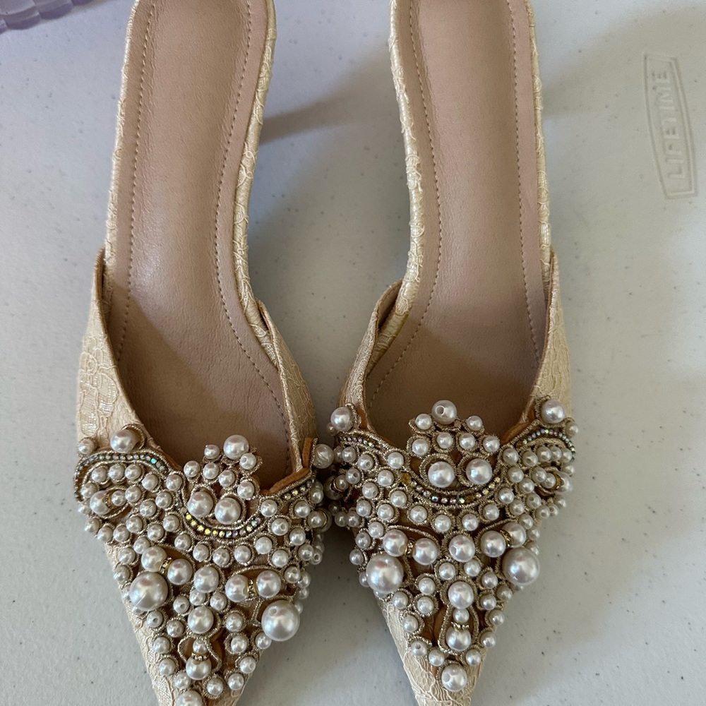 Low heeled embellished shoes.
